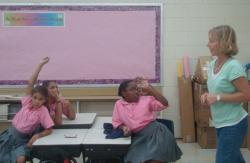 Therese Donarsk, right, helps student plan how to take care of a pet during a hurricane at the Alfredo Andrews Elementary School after-school program. Therese Donarsk, right, helps student plan how to take care of a pet during a hurricane at the Alfredo Andrews Elementary School after-school program.